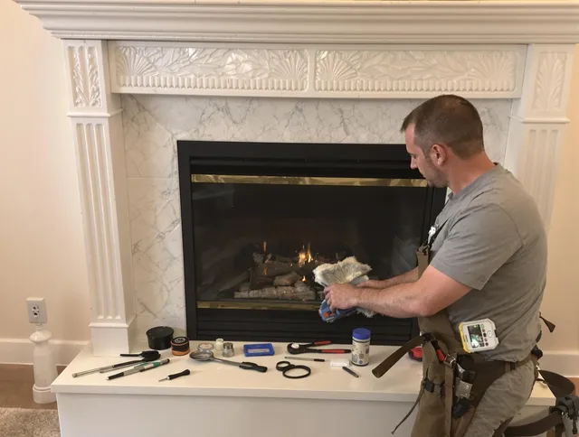 Winthrop Chimney Sweep performing fireplace maintenance in Winthrop, MA