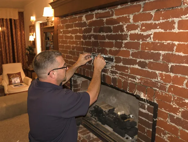 Winthrop Chimney Sweep expert fixing a fireplace in Winthrop, MA